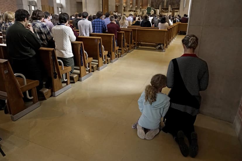 ap-people-at-mass-scaled-1778809736.jpg